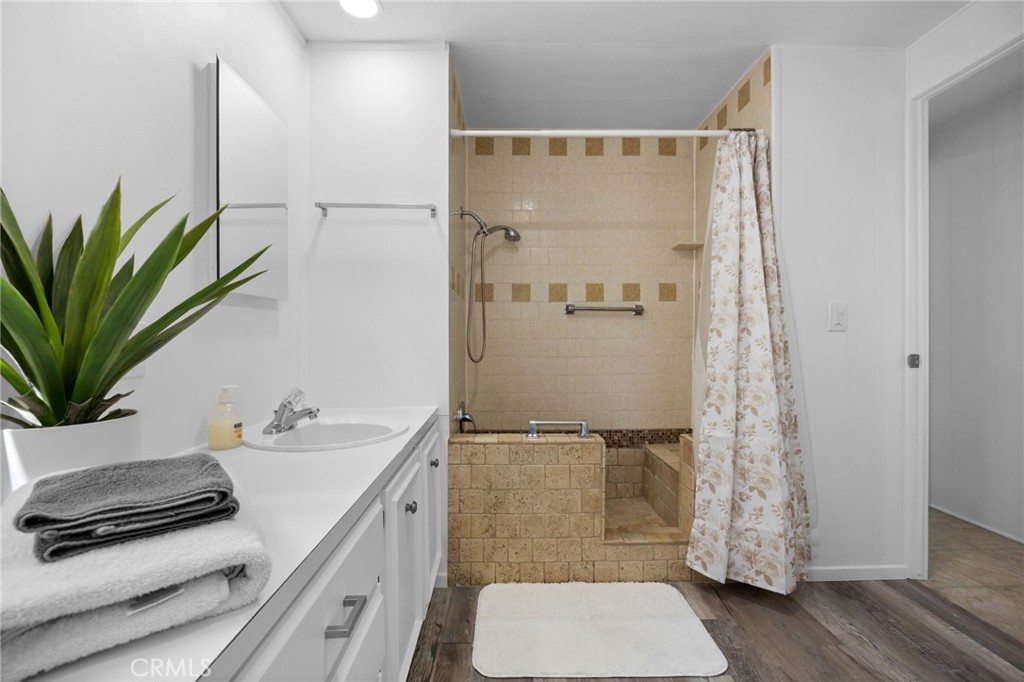 995 Pomona Road, Unit 88 Corona, CA 92882 - Photo 12 of 31 a bathroom with a sink a toilet and shower