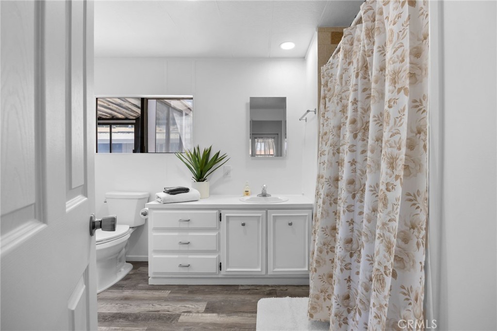 995 Pomona Road, Unit 88 Corona, CA 92882 - Photo 14 of 31 a bathroom with a sink a vanity and a mirror