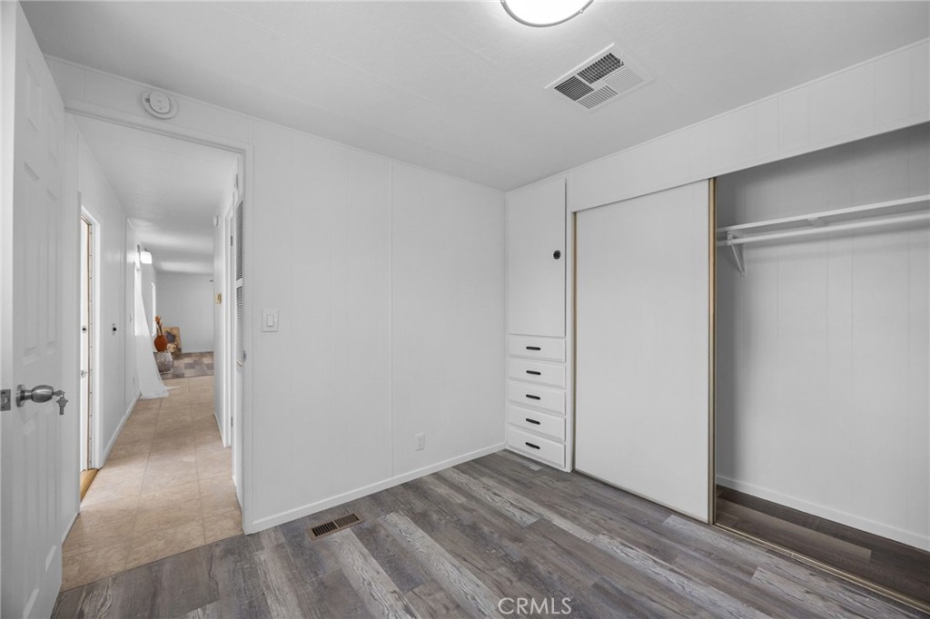995 Pomona Road, Unit 88 Corona, CA 92882 - Photo 15 of 31 wooden floor and closet in a room