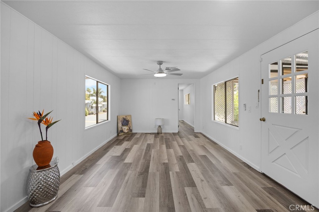 995 Pomona Road, Unit 88 Corona, CA 92882 - Photo 29 of 31 a bedroom with a bed and wooden floor