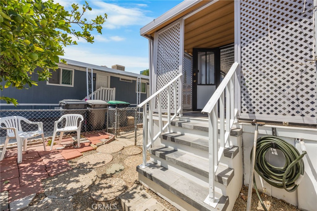 995 Pomona Road, Unit 88 Corona, CA 92882 - Photo 6 of 31 a view of a house with wooden deck and furniture