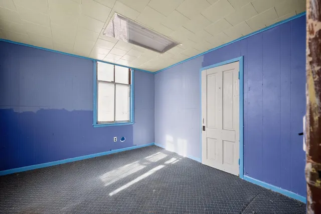 a view of an empty room with windows