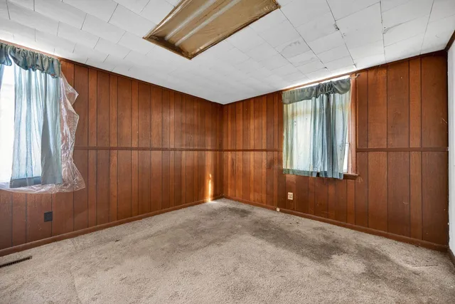 a bedroom with a television and a bed