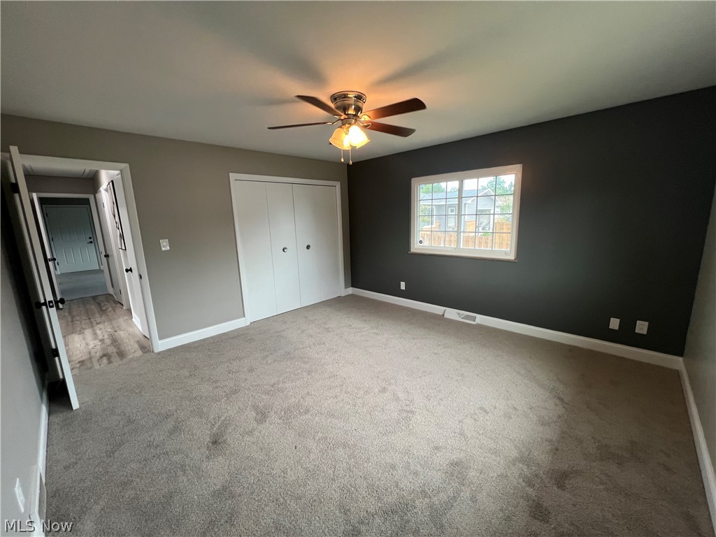 7475 Selwick Drive Parma, OH 44129 - Photo 17 of 29 Unfurnished bedroom featuring a closet, carpet, and ceiling fan