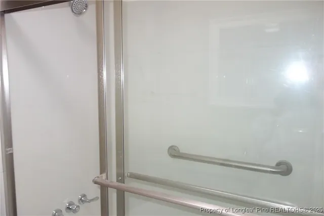 a bathroom with a sink toilet and window