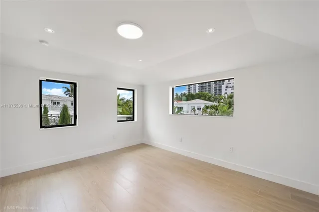a room with gym equipment and a large window