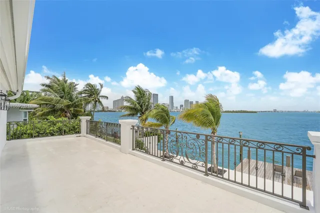 a view of a balcony with lake view and mountain view