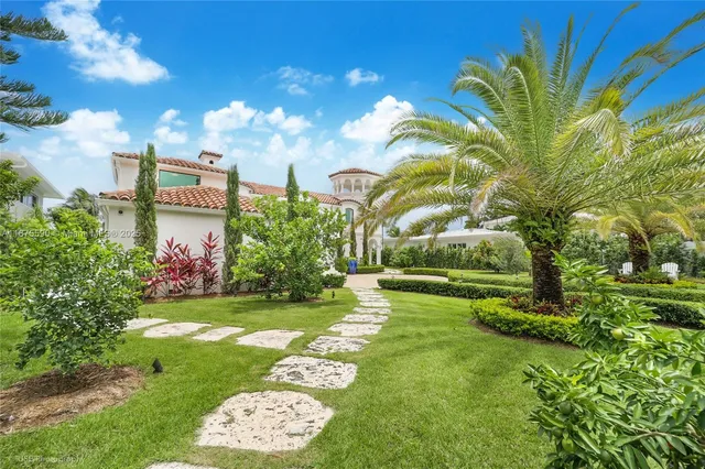 a view of a brick house with a yard