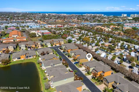 an aerial view of a house with a ocean view