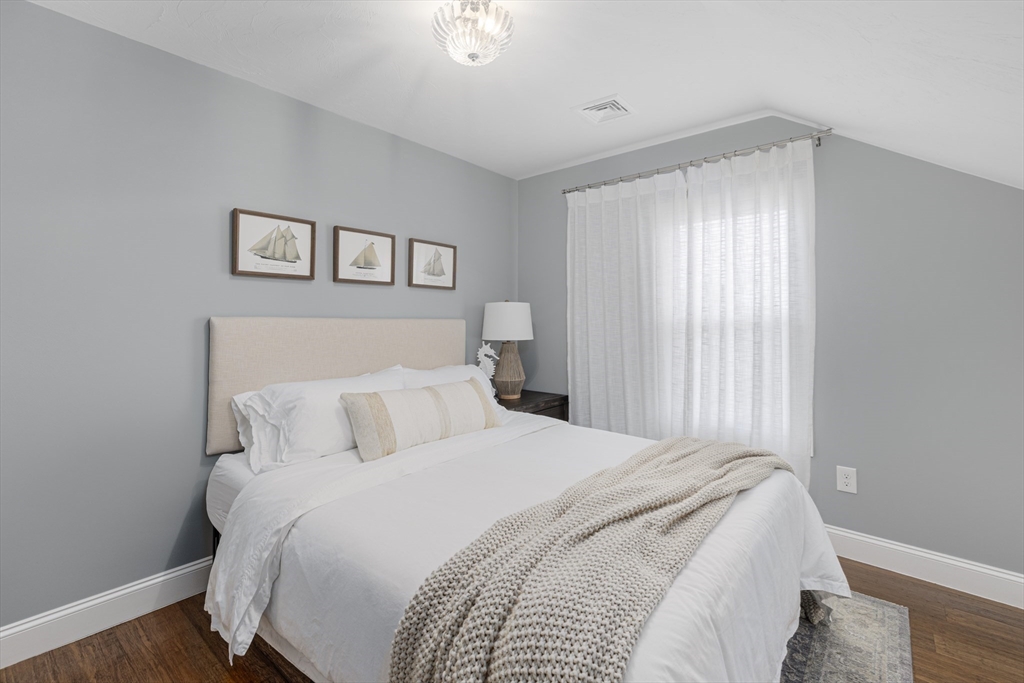 69 Denver Street Fall River, MA 02721 - Photo 31 of 35 a bedroom with a large bed and a window