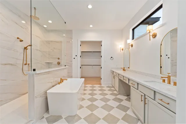 a bathroom with a bathtub and shower