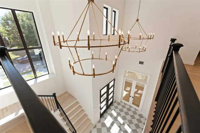 a view of a livingroom with wooden floor and a large window