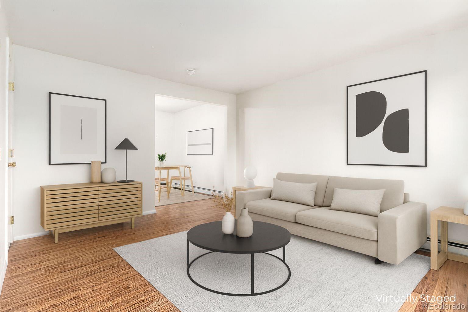 8976 West 46th Place, Unit 8976 Wheat Ridge, CO 80033 - Photo 1 of 10 a living room with furniture