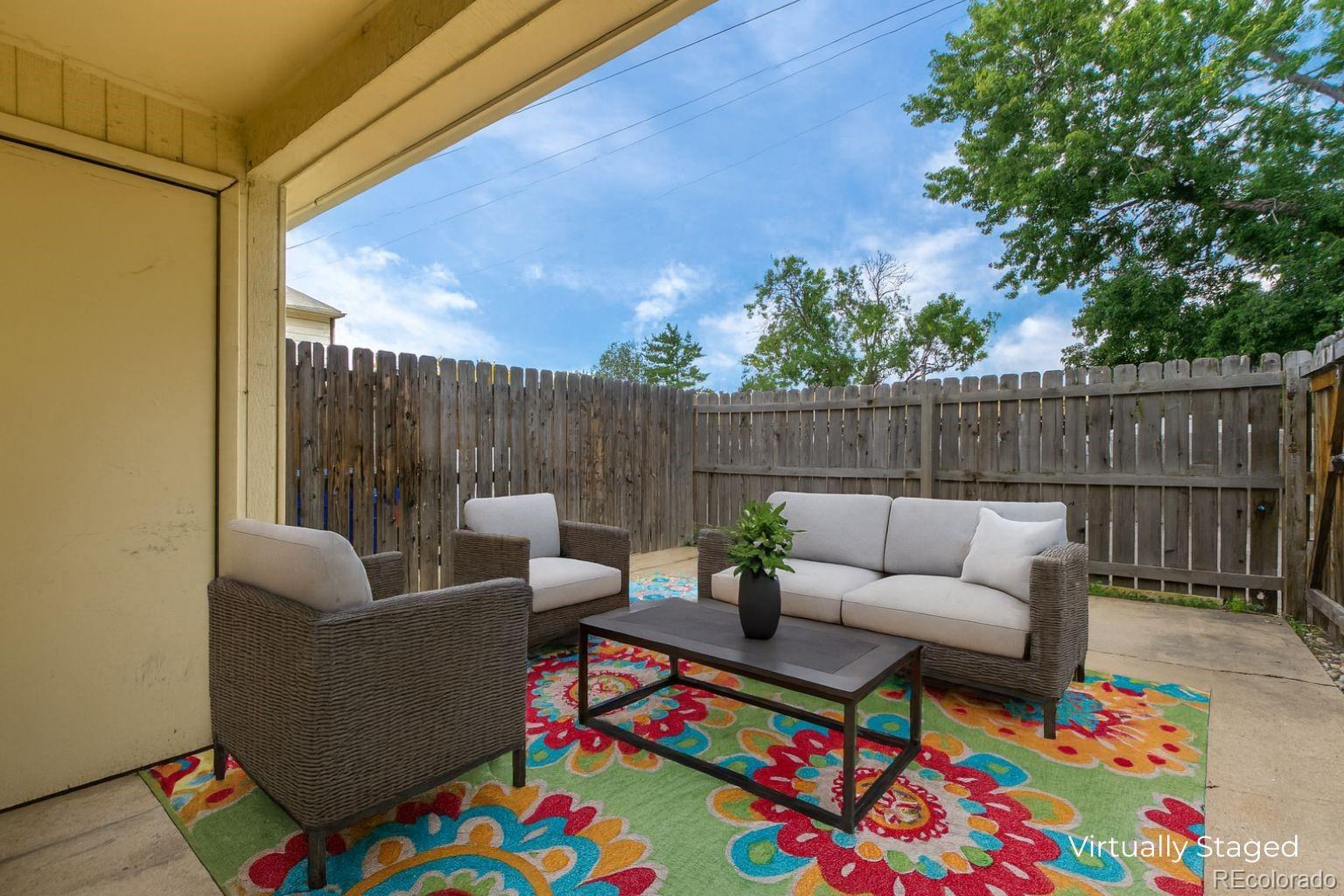 8976 West 46th Place, Unit 8976 Wheat Ridge, CO 80033 - Photo 4 of 10 a building outdoor space with patio furniture