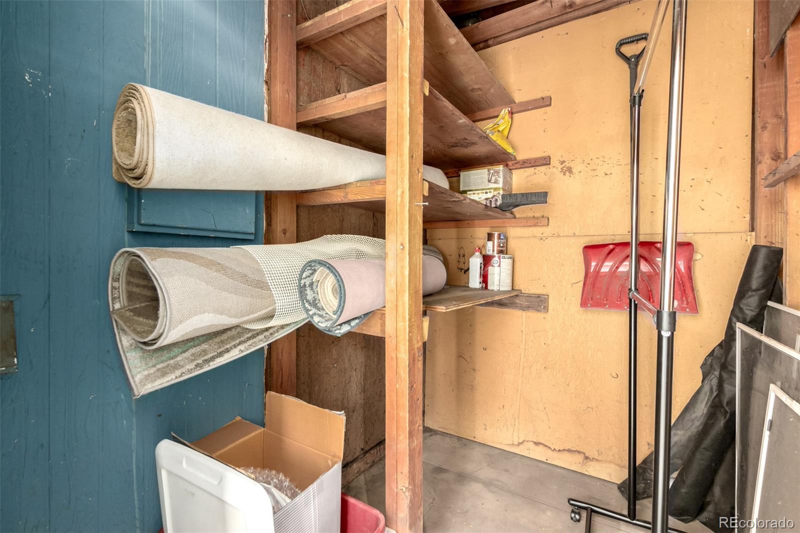 8976 West 46th Place, Unit 8976 Wheat Ridge, CO 80033 - Photo 9 of 10 a blue and white refrigerator sitting in a kitchen