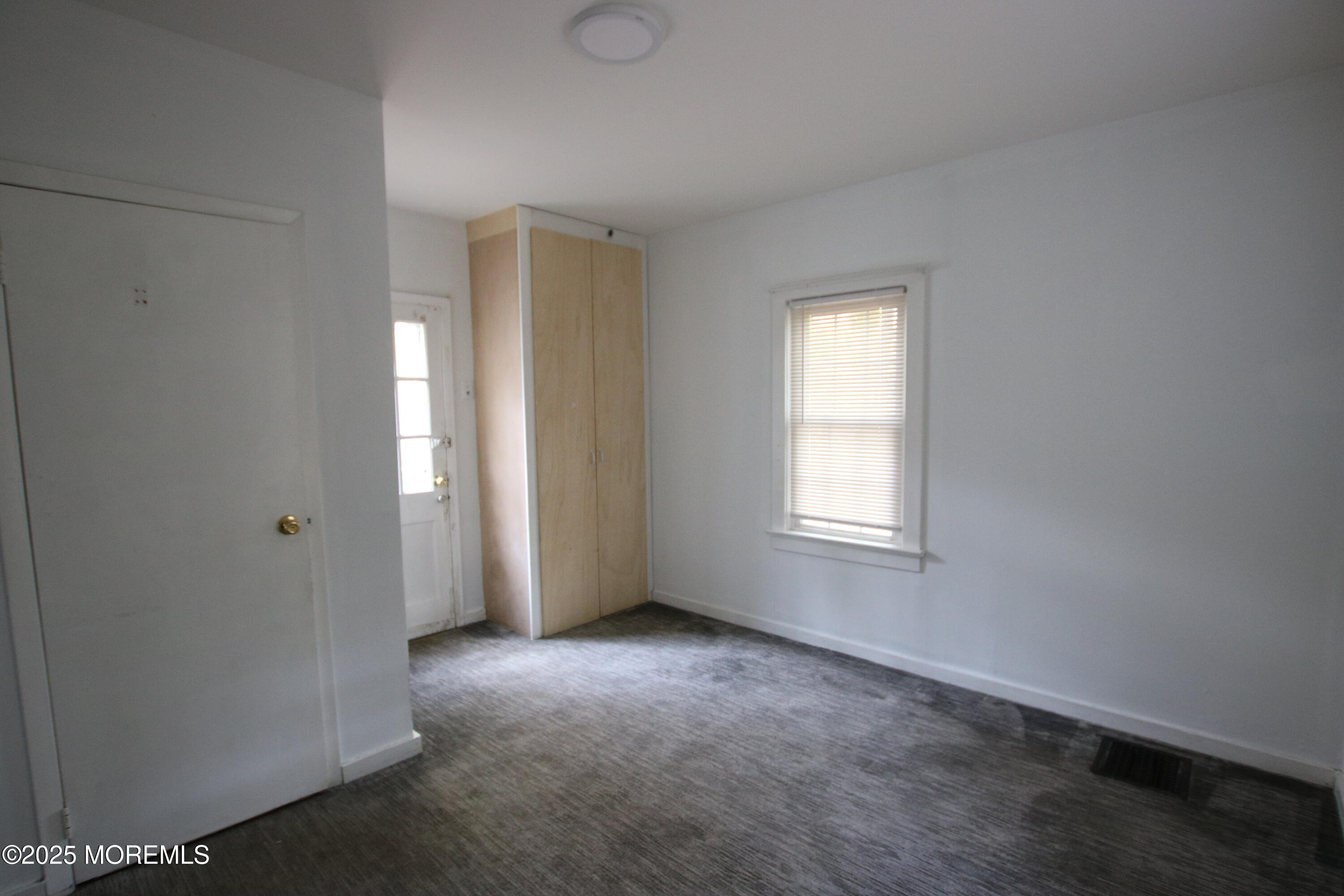 58 Monmouth Road Eatontown, NJ 07724 - Photo 12 of 32 an empty room with windows
