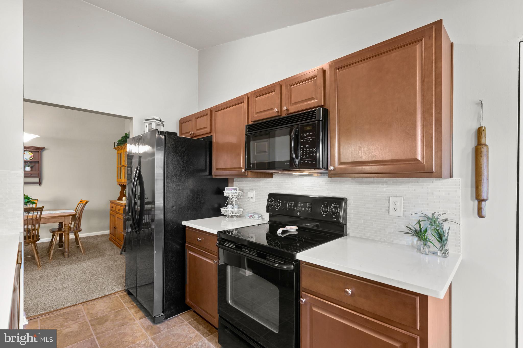3506 Back Pointe Court, Unit 3D Abingdon, MD 21009 - Photo 21 of 33 a kitchen with stainless steel appliances a stove microwave and refrigerator