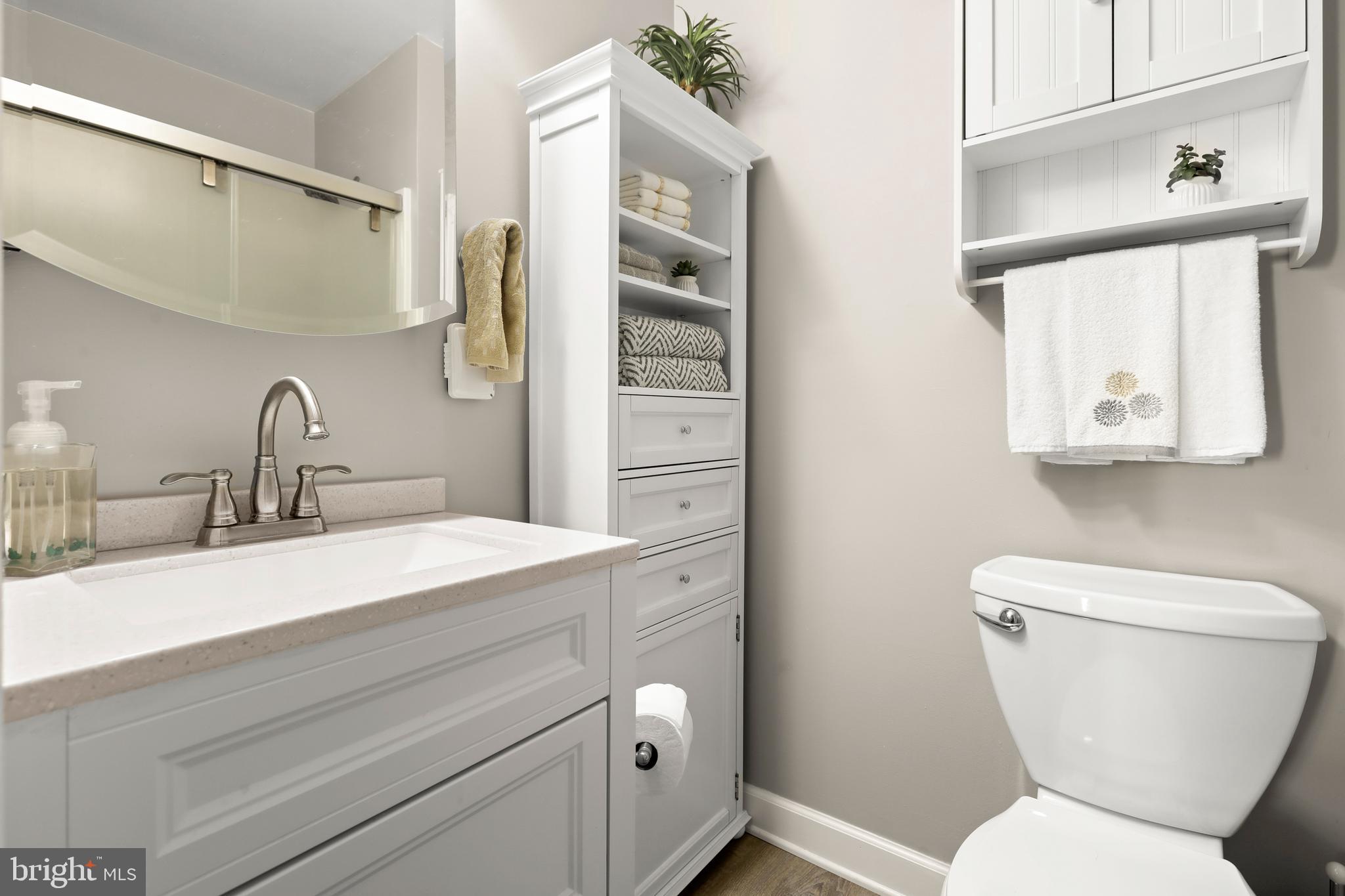 3506 Back Pointe Court, Unit 3D Abingdon, MD 21009 - Photo 27 of 33 a bathroom with a toilet sink and mirror