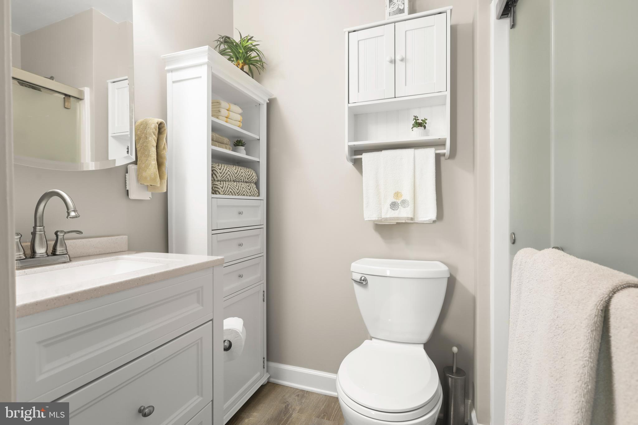 3506 Back Pointe Court, Unit 3D Abingdon, MD 21009 - Photo 28 of 33 a bathroom with a toilet a sink and mirror