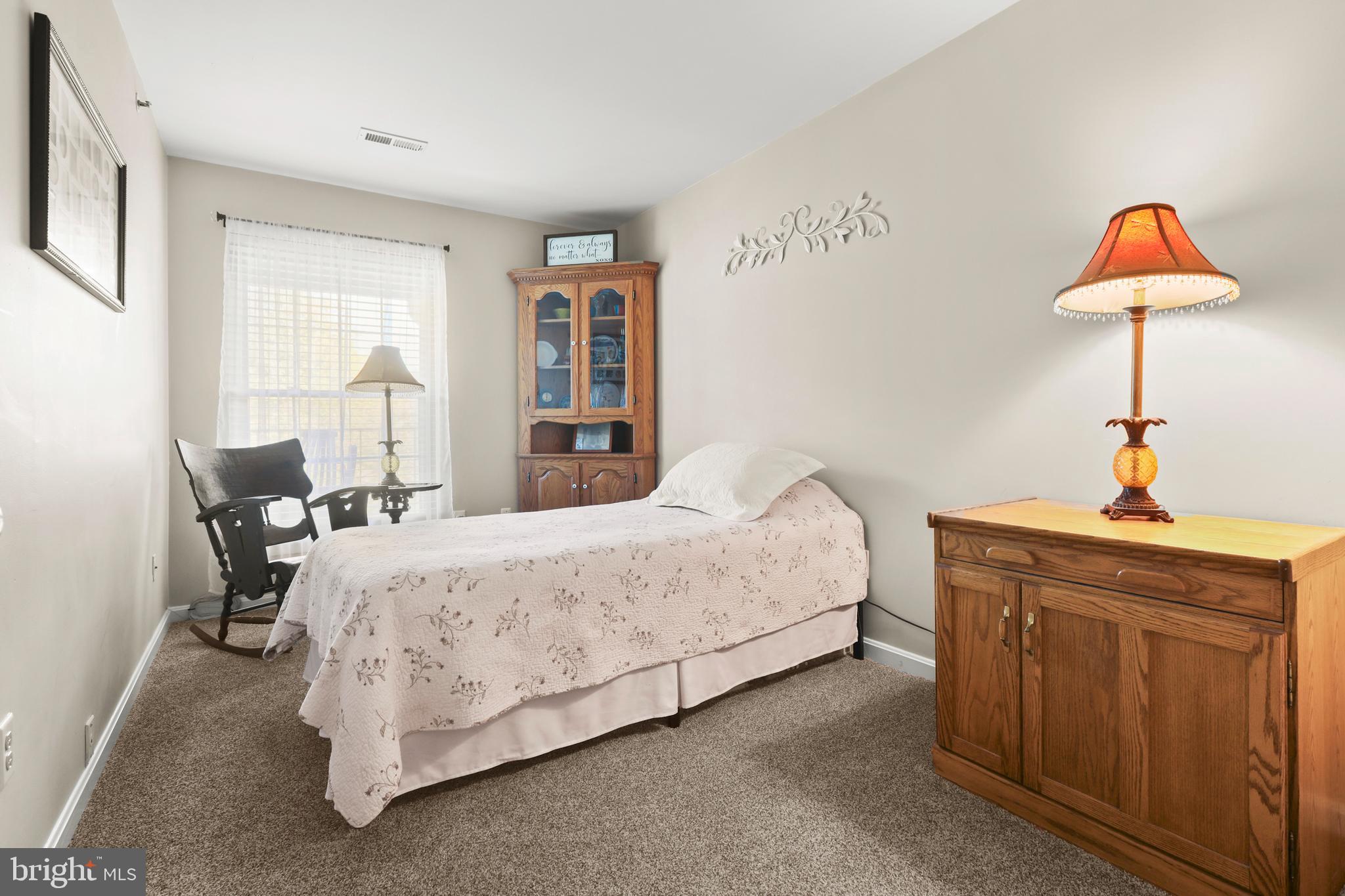 3506 Back Pointe Court, Unit 3D Abingdon, MD 21009 - Photo 29 of 33 a bedroom with a bed and a chandelier