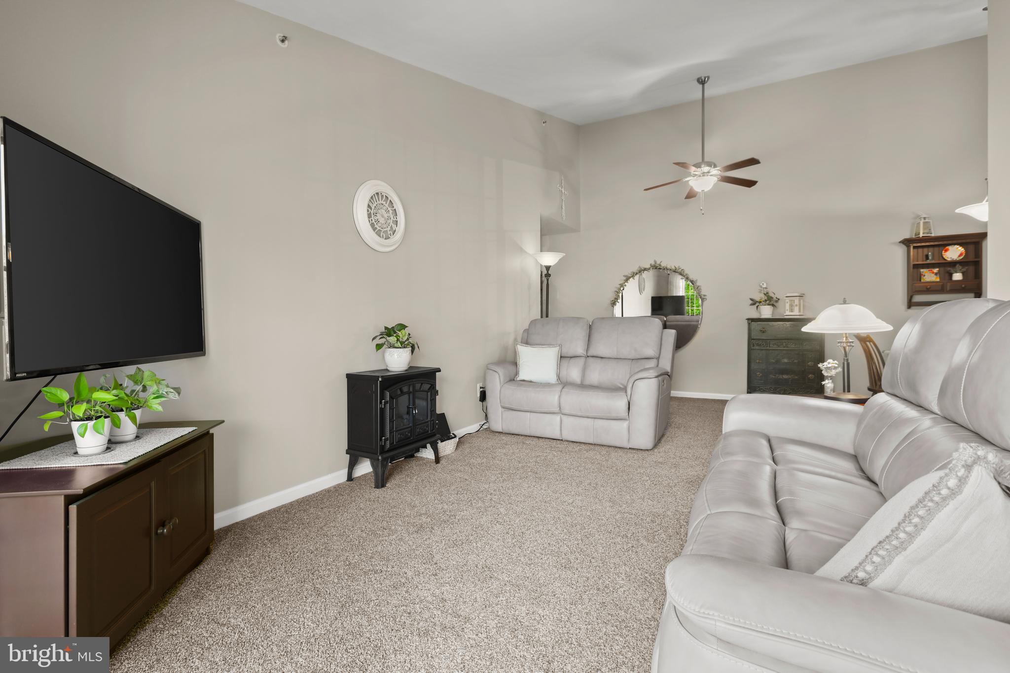 3506 Back Pointe Court, Unit 3D Abingdon, MD 21009 - Photo 8 of 33 a living room with furniture and a flat screen tv