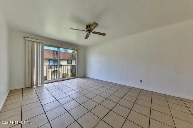 a view of empty room with windows