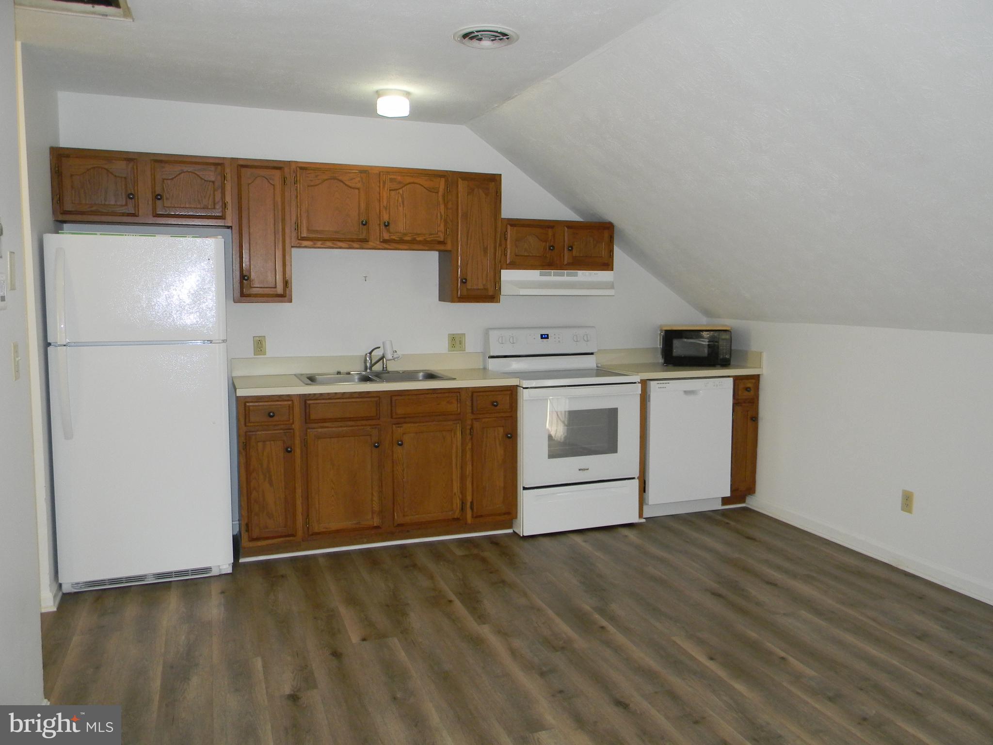 2 Valley View Drive, Unit 1 Rising Sun, MD 21911 - Photo 5 of 10 a kitchen with a sink a stove a refrigerator and cabinets