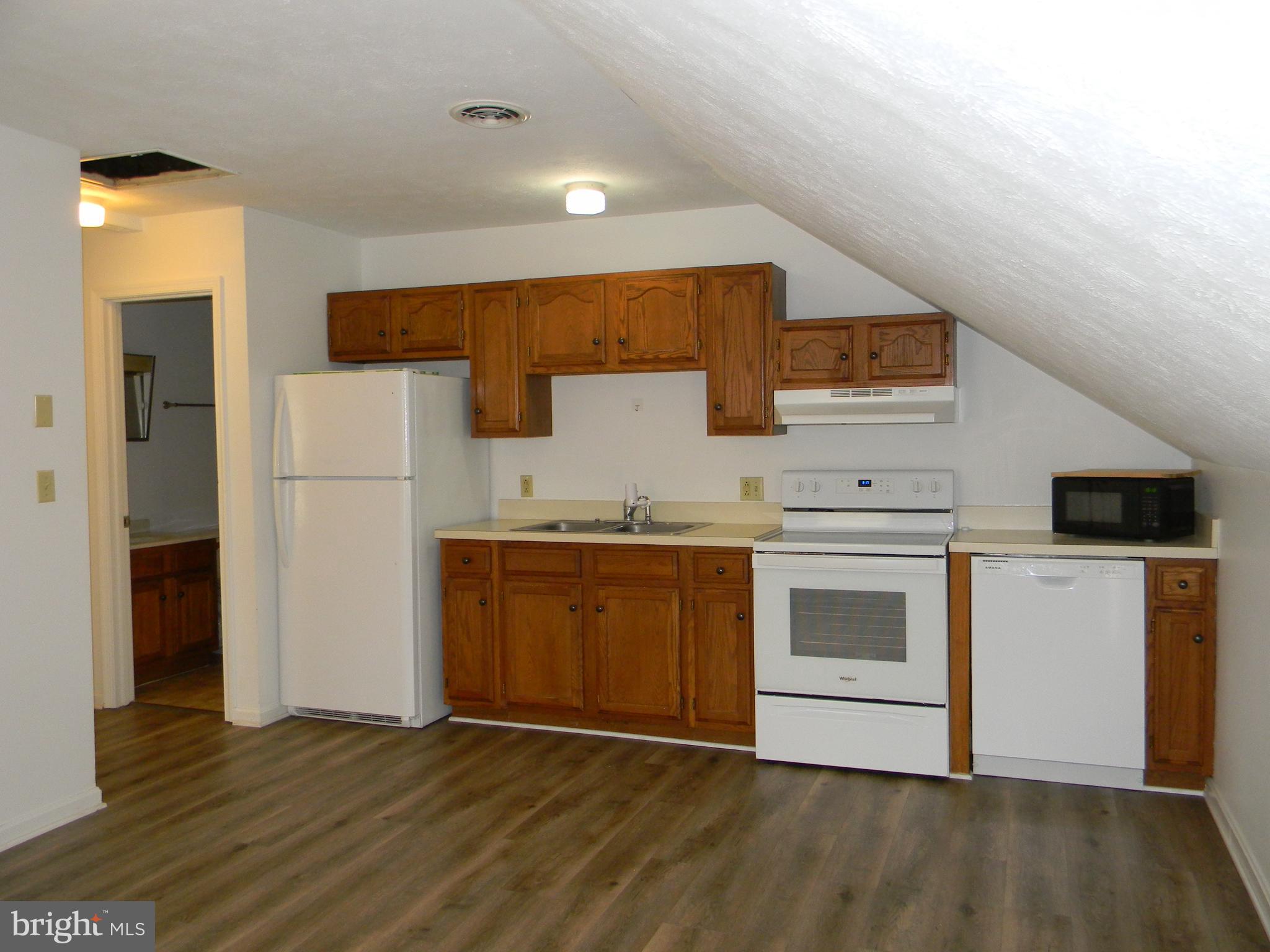 2 Valley View Drive, Unit 1 Rising Sun, MD 21911 - Photo 6 of 10 a kitchen with a refrigerator and a stove