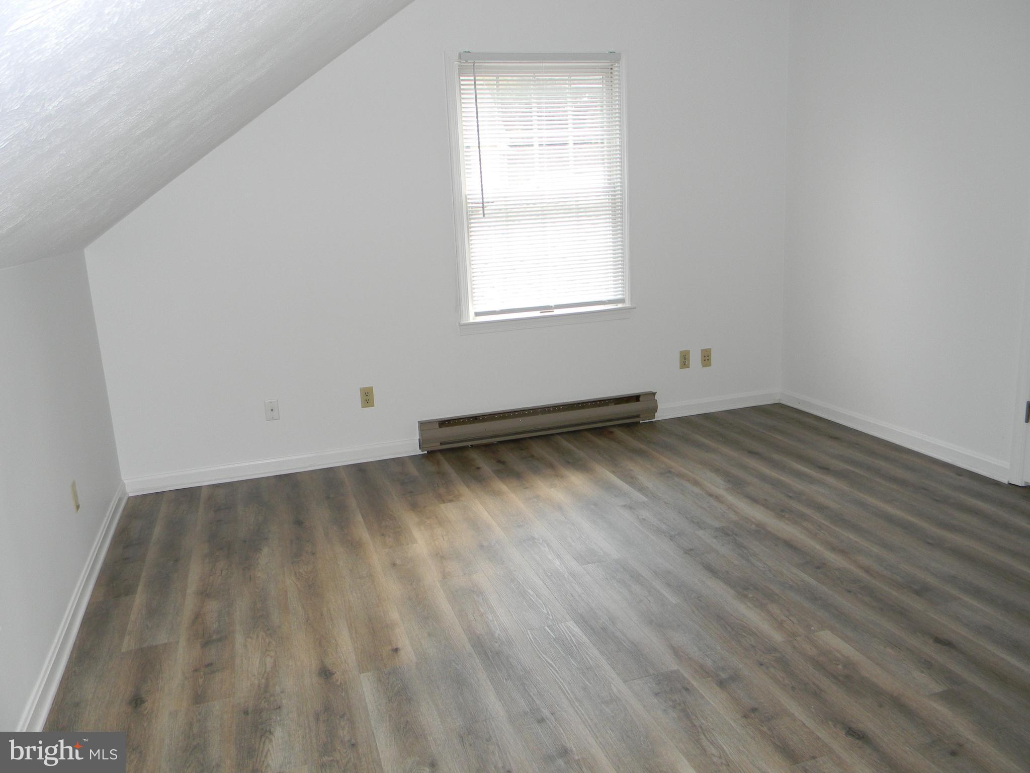 2 Valley View Drive, Unit 1 Rising Sun, MD 21911 - Photo 7 of 10 an empty room with wooden floor and windows