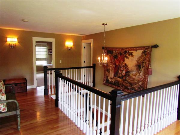 50 Adams Road Grafton, MA 01536 - Photo 18 of 30 a view of a hallway with wooden floor and windows
