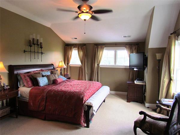 50 Adams Road Grafton, MA 01536 - Photo 19 of 30 a bedroom with a bed couch and a chandelier