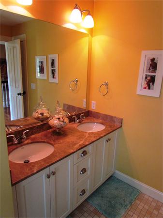 50 Adams Road Grafton, MA 01536 - Photo 22 of 30 a bathroom with a sink and a mirror