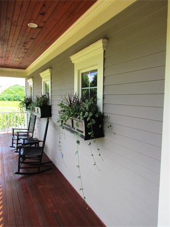 50 Adams Road Grafton, MA 01536 - Photo 25 of 30 a view of patio with chairs and potted plants