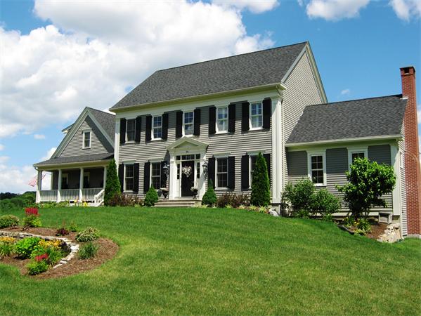 50 Adams Road Grafton, MA 01536 - Photo 27 of 30 a front view of a house with a garden and plants