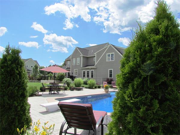 50 Adams Road Grafton, MA 01536 - Photo 3 of 30 a view of a house with swimming pool and a chairs