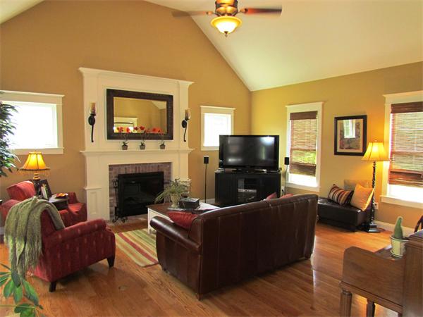 50 Adams Road Grafton, MA 01536 - Photo 9 of 30 a living room with furniture a flat screen tv and a fireplace
