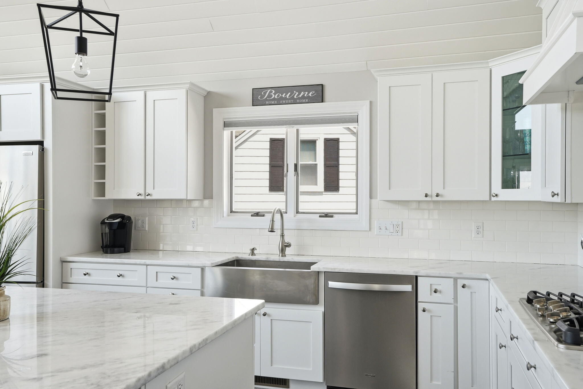 4 Cross Road Bourne, MA 02532 - Photo 8 of 47 a kitchen with stainless steel appliances granite countertop a sink stove and refrigerator