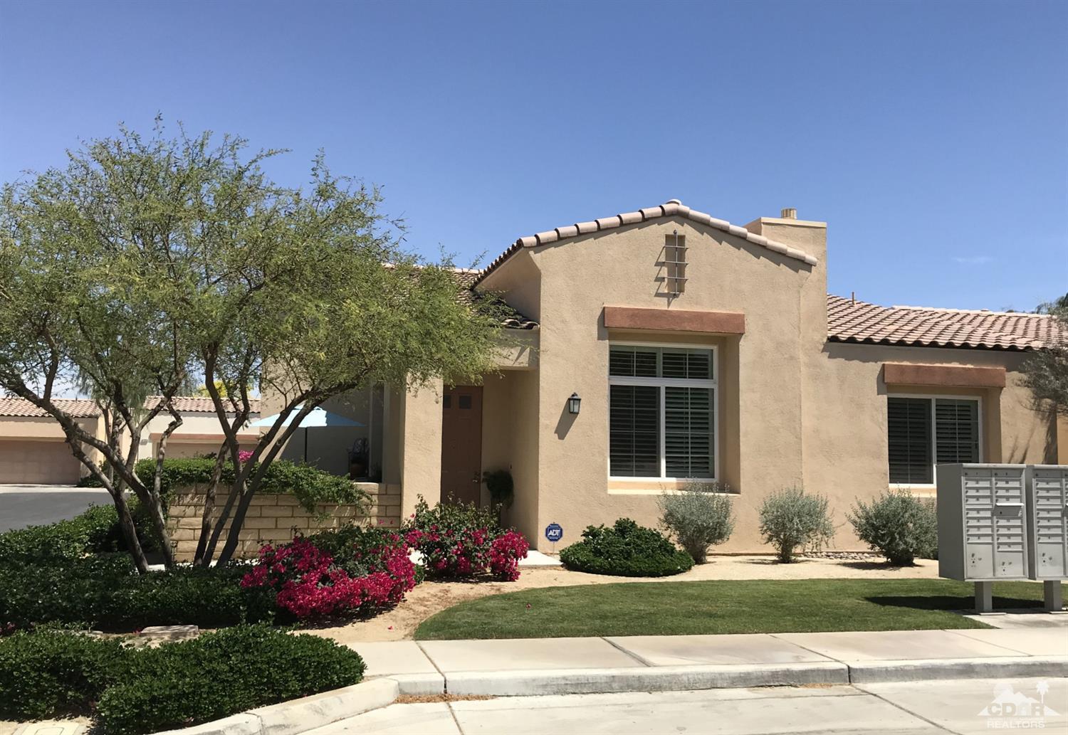47848 Dancing Butterfly La Quinta, CA 92253 - Photo 1 of 36 a front view of a house with garden