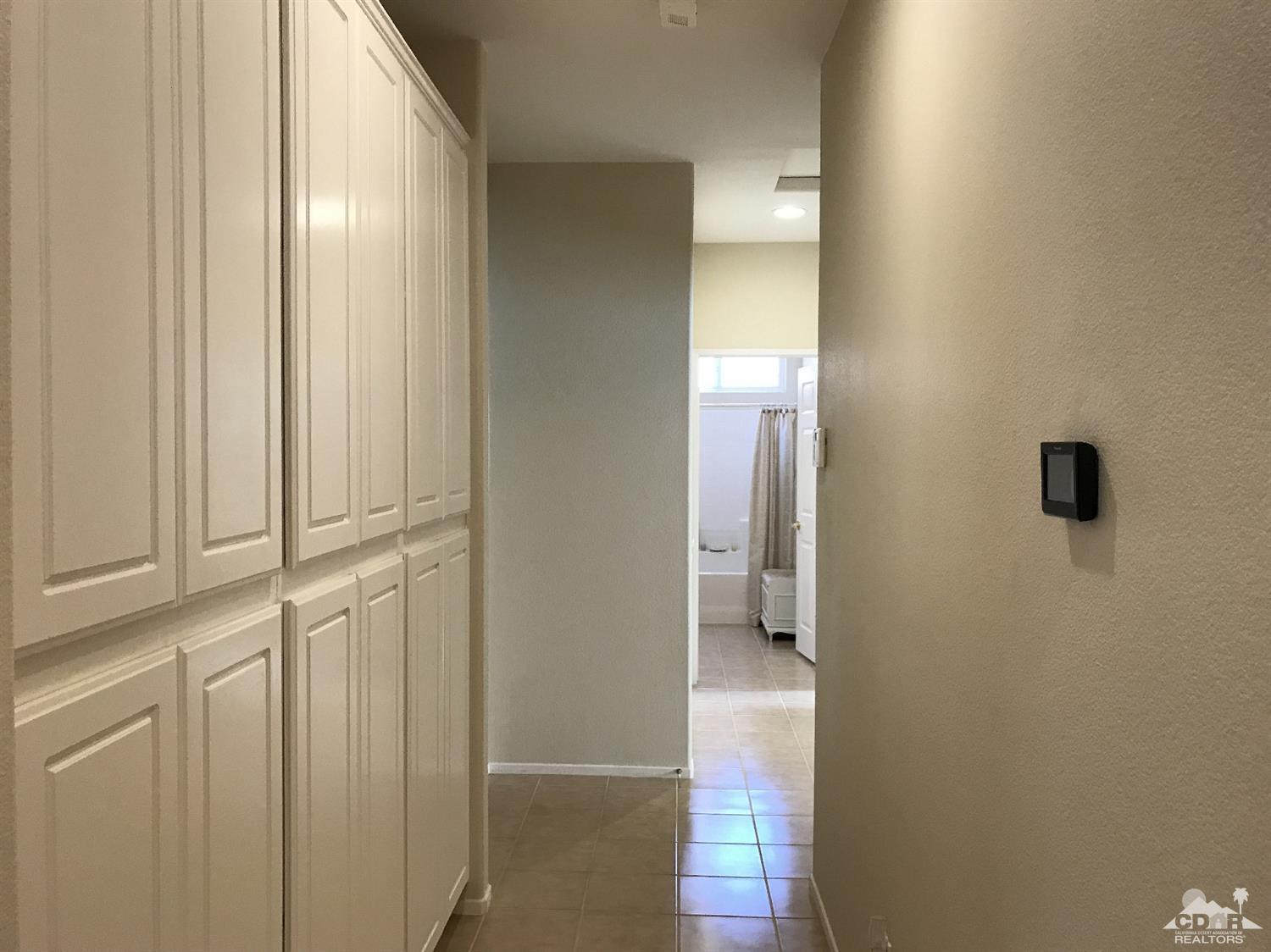 47848 Dancing Butterfly La Quinta, CA 92253 - Photo 13 of 36 a view of a bathroom with mirror