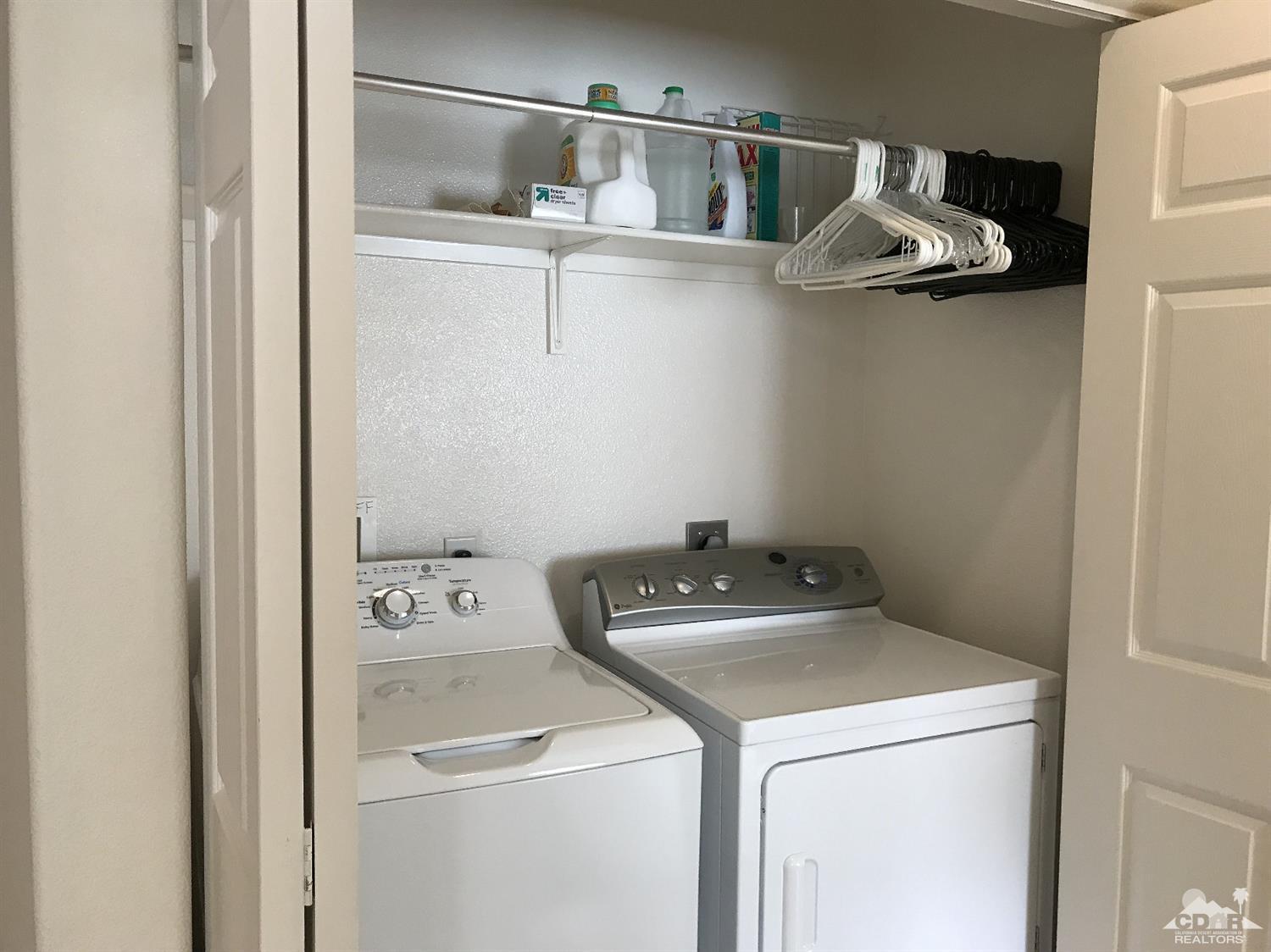 47848 Dancing Butterfly La Quinta, CA 92253 - Photo 14 of 36 a utility room with dryer and washer