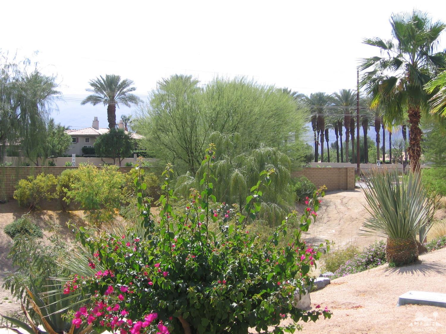 47848 Dancing Butterfly La Quinta, CA 92253 - Photo 34 of 36 a view of flower garden in a backyard