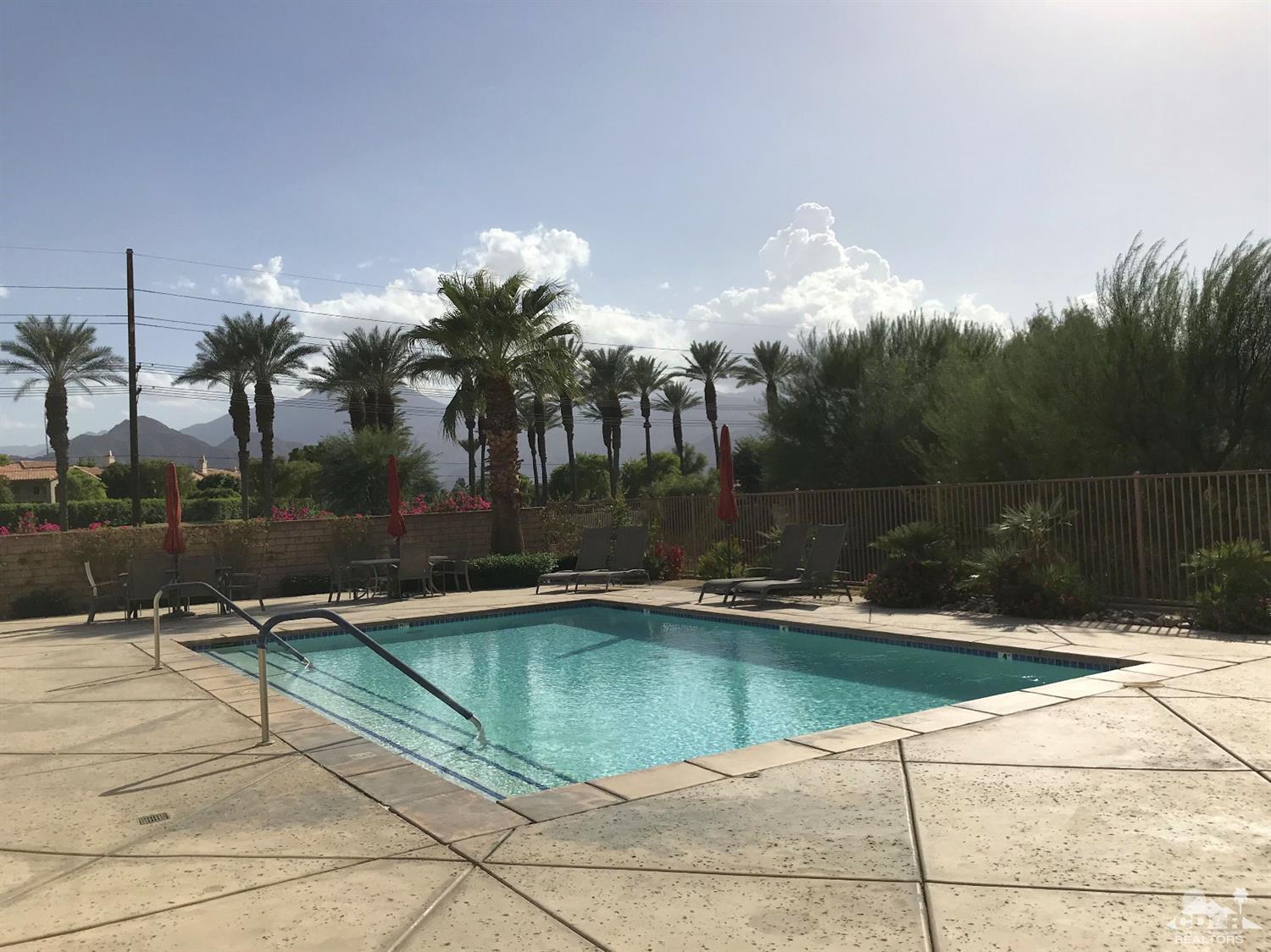 47848 Dancing Butterfly La Quinta, CA 92253 - Photo 5 of 36 a view of swimming pool with outdoor seating and plants