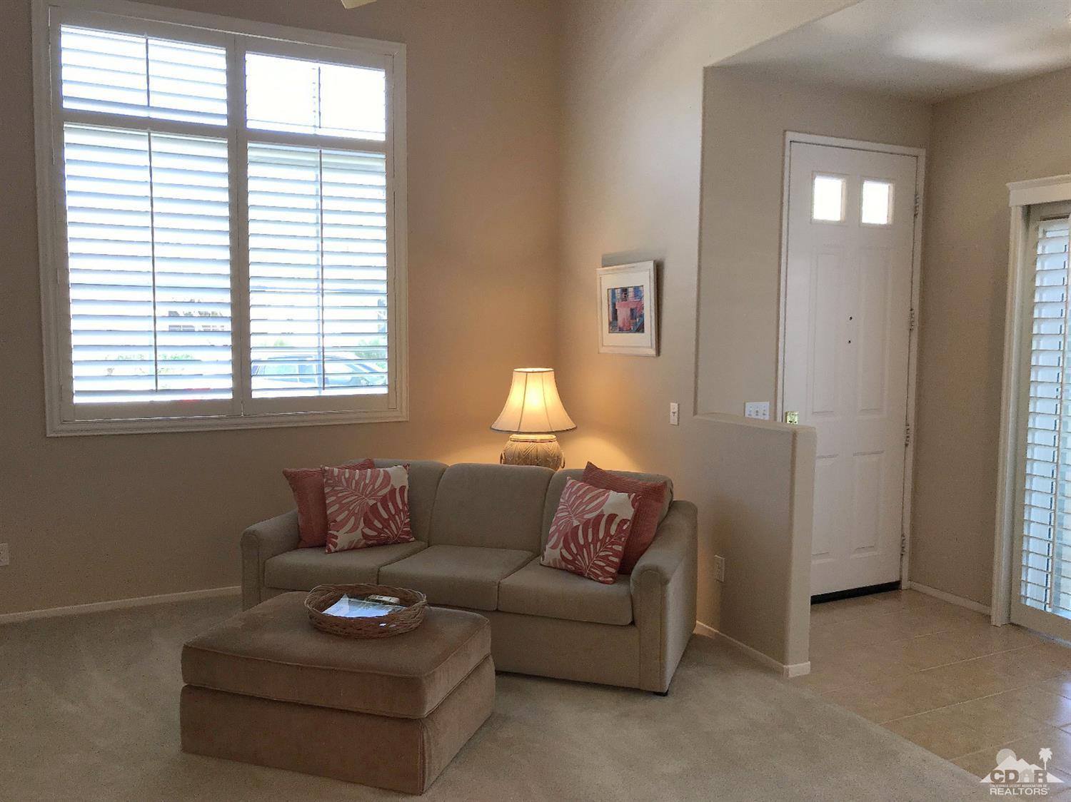 47848 Dancing Butterfly La Quinta, CA 92253 - Photo 6 of 36 a living room with furniture and a window