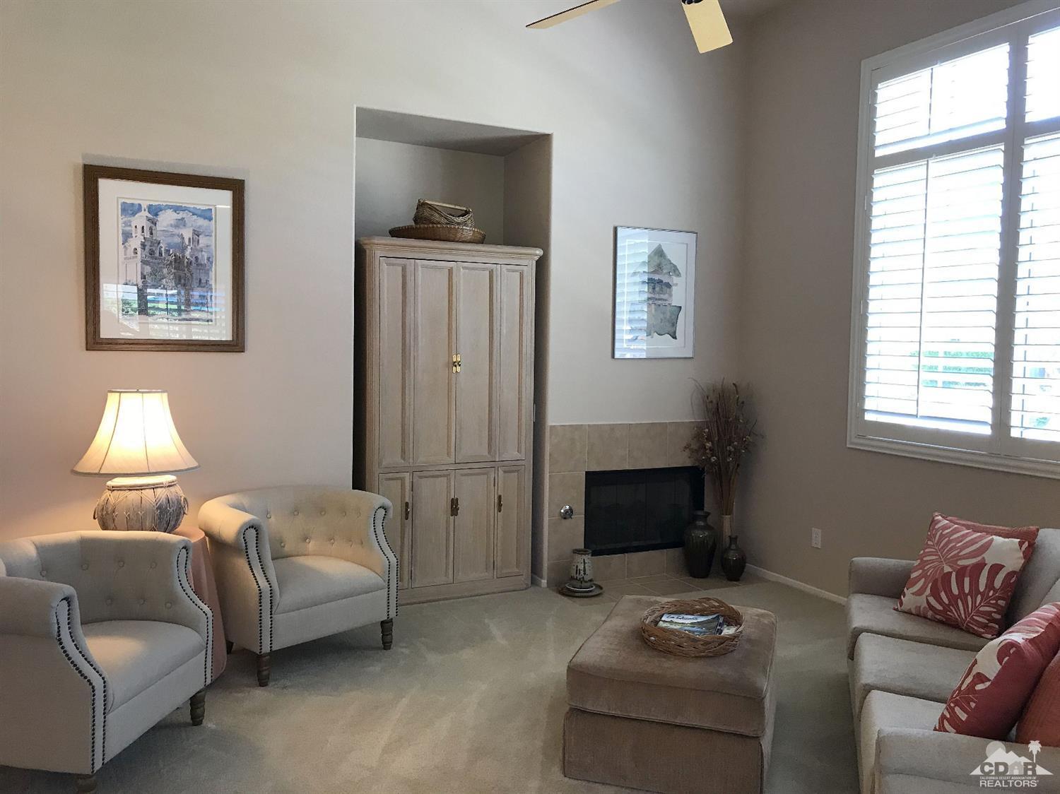 47848 Dancing Butterfly La Quinta, CA 92253 - Photo 7 of 36 a bedroom with furniture and a fireplace