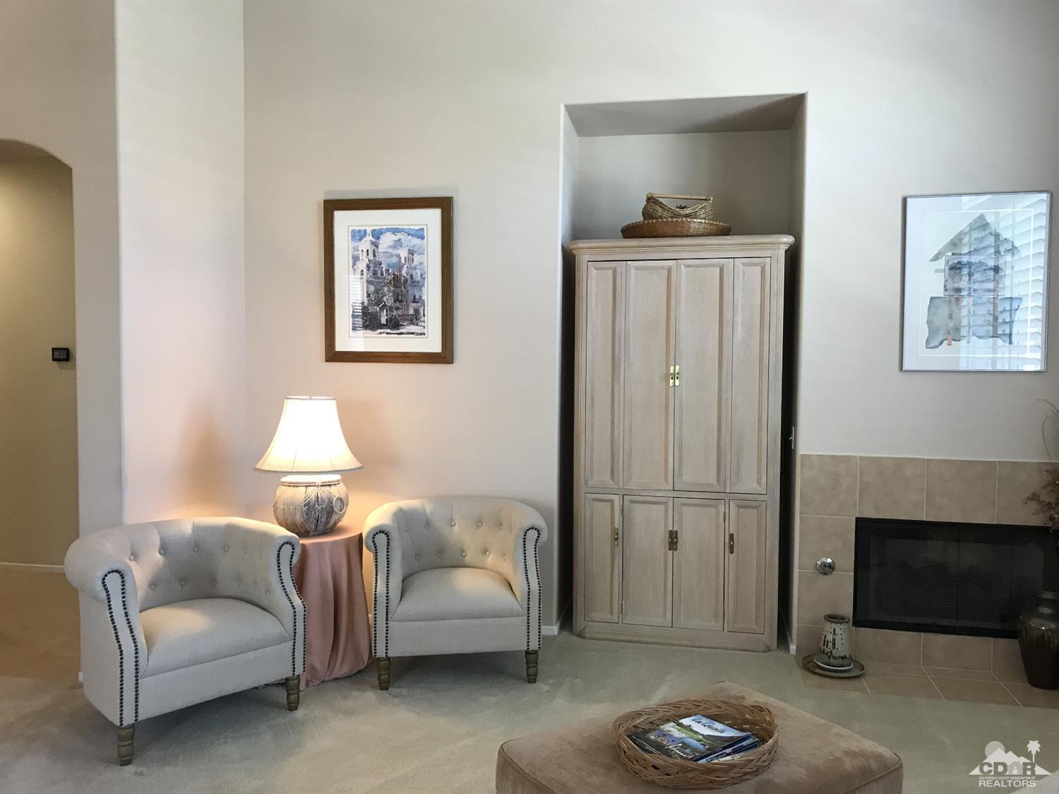 47848 Dancing Butterfly La Quinta, CA 92253 - Photo 8 of 36 a living room with furniture and a fireplace