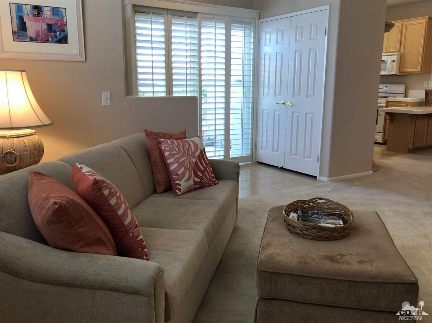 47848 Dancing Butterfly La Quinta, CA 92253 - Photo 9 of 36 a living room with furniture and a window