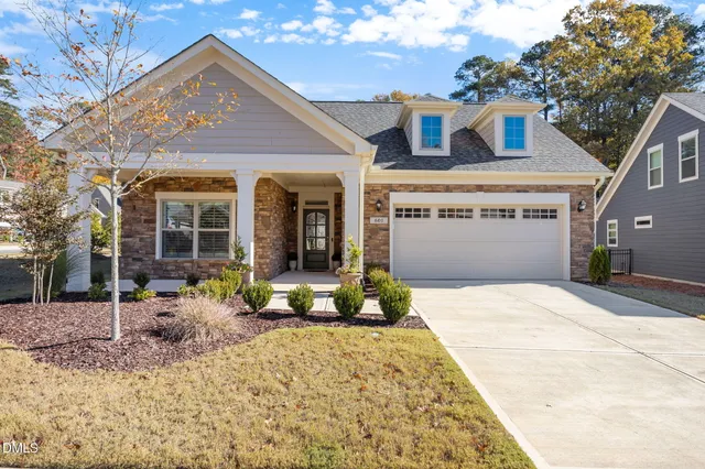 an aerial view of a house with a ocean view