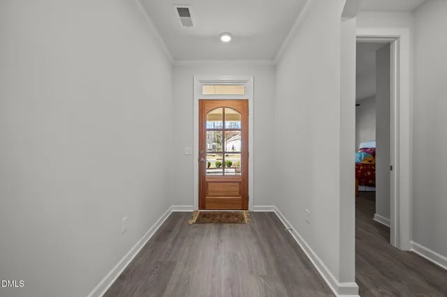 a kitchen that has a lot of cabinets in it and appliances