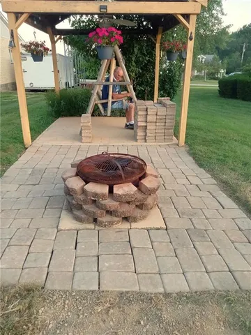 a view of a backyard with sitting area