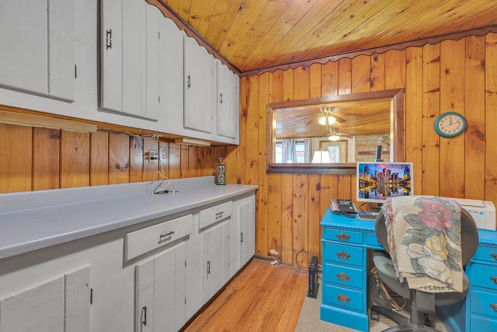 193 Salem Church Road Midland, PA 15059 - Photo 25 of 44 Den makes for a great home office with lots of storage and original hard wood flooring.